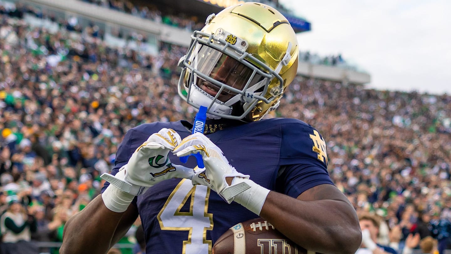 Nov 22, 2025; South Bend, Indiana, USA; Notre Dame Fighting Irish running back Jeremiyah Love (4) celebrates scoring against the Syracuse Orange during the first half at Notre Dame Stadium. Mandatory Credit: Michael Caterina-Imagn Images