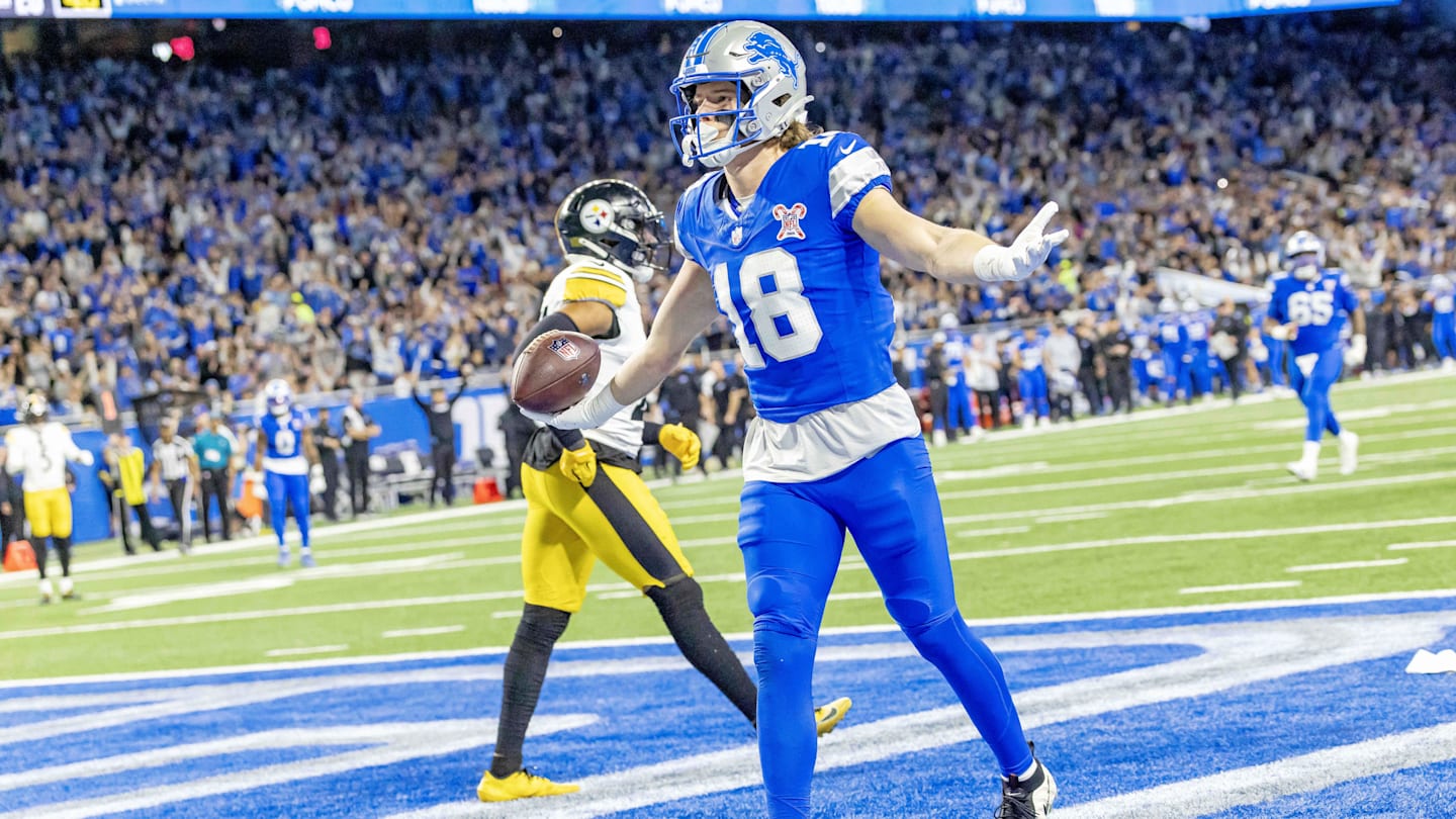 Dec 21, 2025; Detroit, Michigan, USA; Detroit Lions wide receiver Isaac Teslaa (18) scores a touchdown during the third quarter against the Pittsburgh Steelers at Ford Field. Mandatory Credit: David Reginek-Imagn Images