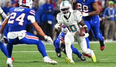 Sep 18, 2025; Orchard Park, New York, USA; Miami Dolphins wide receiver Tyreek Hill (10) runs against Buffalo Bills linebacker Terrel Bernard (8) and safety Cole Bishop (24) in the second quarter at Highmark Stadium. Mandatory Credit: Mark Konezny-Imagn Images