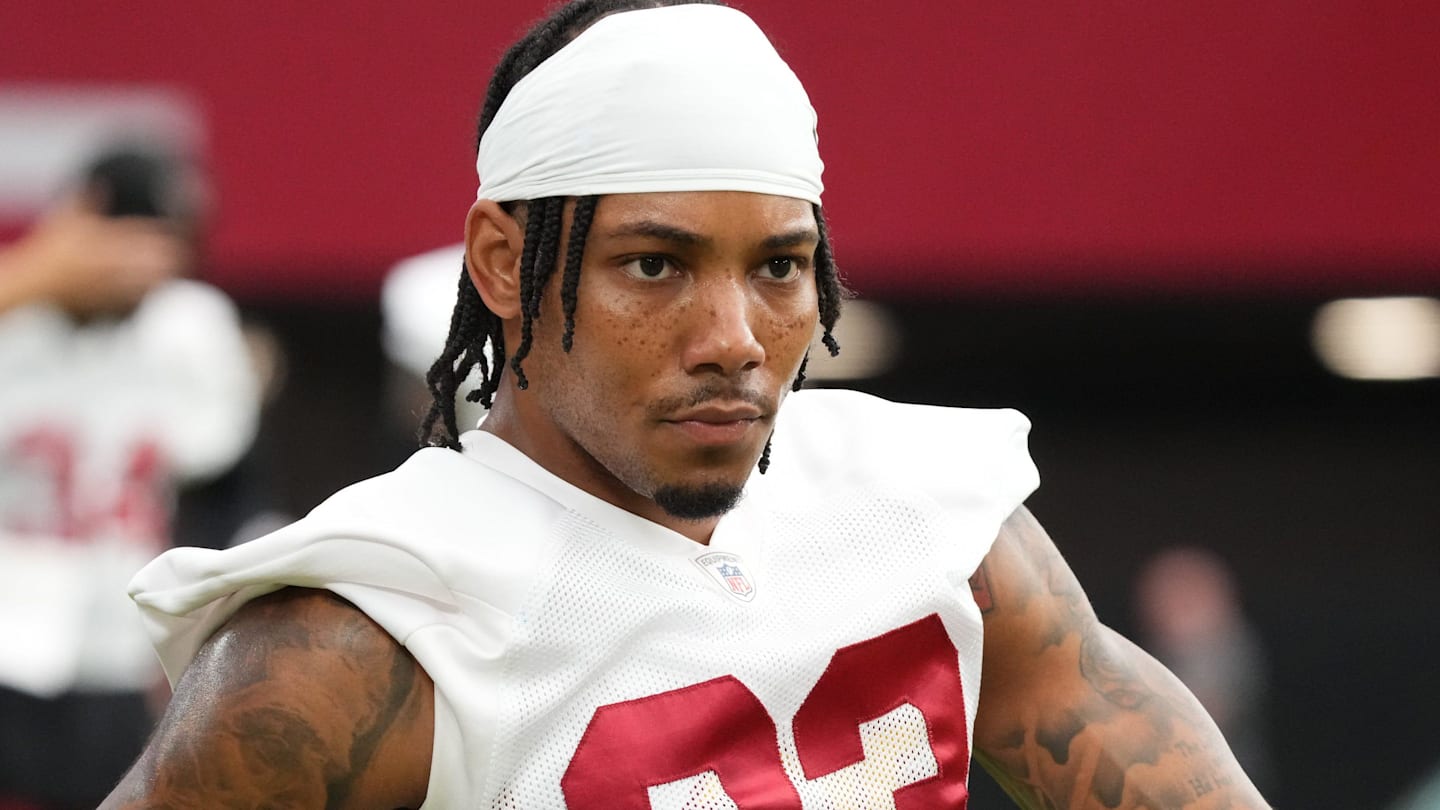 Arizona Cardinals cornerback Sean Murphy-Bunting (23) stretches out along the sidelines during the team's training camp session at State Farm Stadium in Glendale on July 24, 2024.