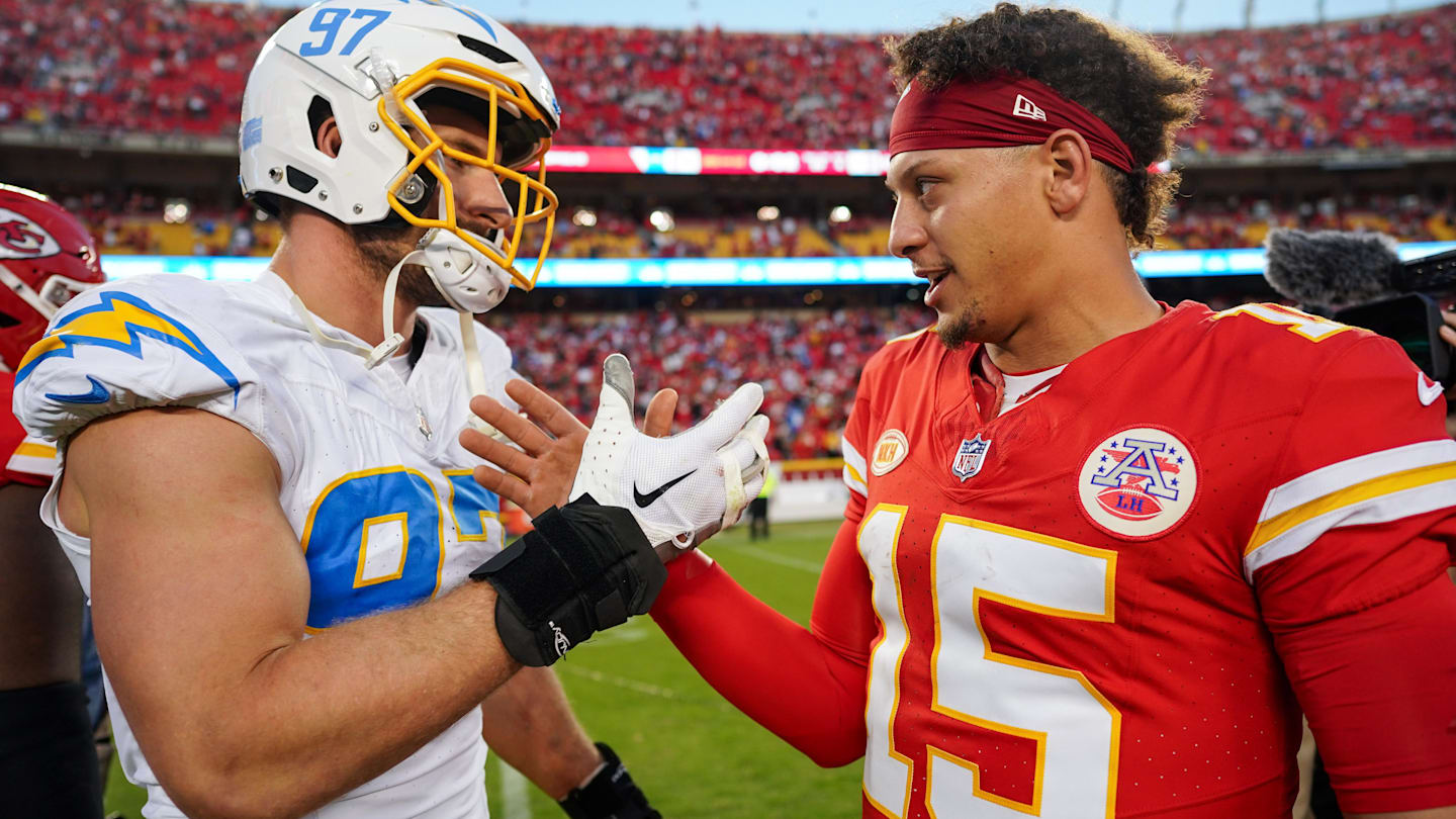 Oct 22, 2023; Kansas City, Missouri, USA; Los Angeles Chargers linebacker Joey Bosa (97) talks with Kansas City Chiefs quarterback Patrick Mahomes (15) after a game at GEHA Field at Arrowhead Stadium.