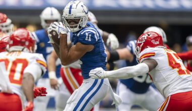 Sep 25, 2022; Indianapolis, Indiana, USA; Indianapolis Colts wide receiver Michael Pittman Jr. (11) catches a pass in front of Kansas City Chiefs linebacker Darius Harris (47) during the second quarter at Lucas Oil Stadium.