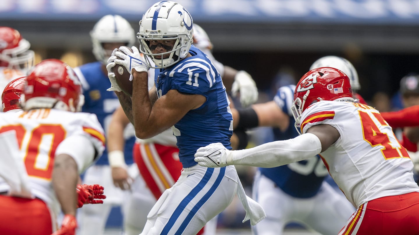 Sep 25, 2022; Indianapolis, Indiana, USA; Indianapolis Colts wide receiver Michael Pittman Jr. (11) catches a pass in front of Kansas City Chiefs linebacker Darius Harris (47) during the second quarter at Lucas Oil Stadium.