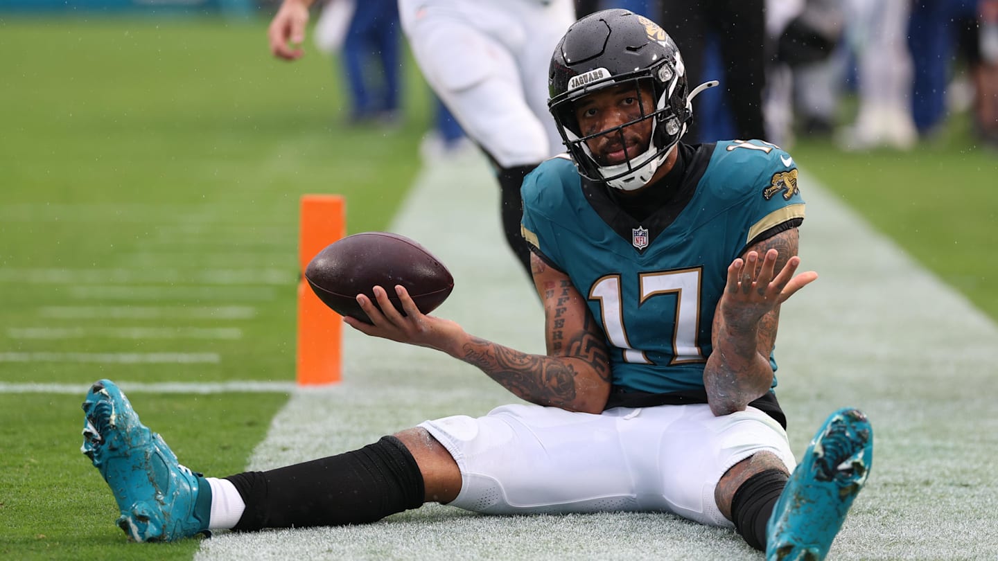 Dec 7, 2025; Jacksonville, Florida, USA;  Jacksonville Jaguars wide receiver Tim Patrick (17) sits on the field after catching a touchdown pass against the Indianapolis Colts during the first half at EverBank Stadium. Mandatory Credit: Matt Pendleton-Imagn Images