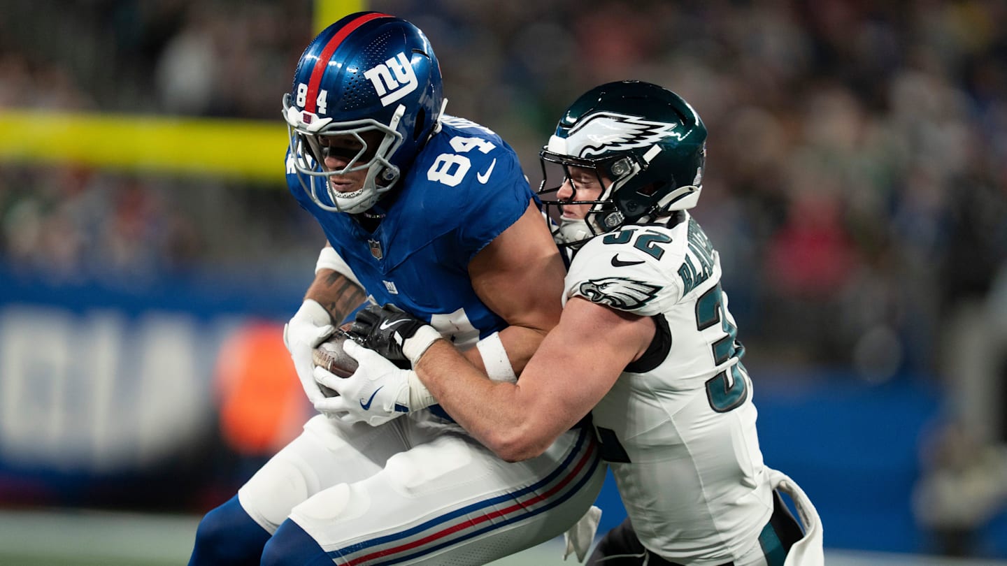 New York Giants tight end Theo Johnson (84) catches a pass before being tackled by Philadelphia Eagles safety Reed Blankenship (32) during a Thursday Night Football game between the New York Giants and the Philadelphia Eagles at MetLife Stadium in East Rutherford on Oct. 9, 2025.