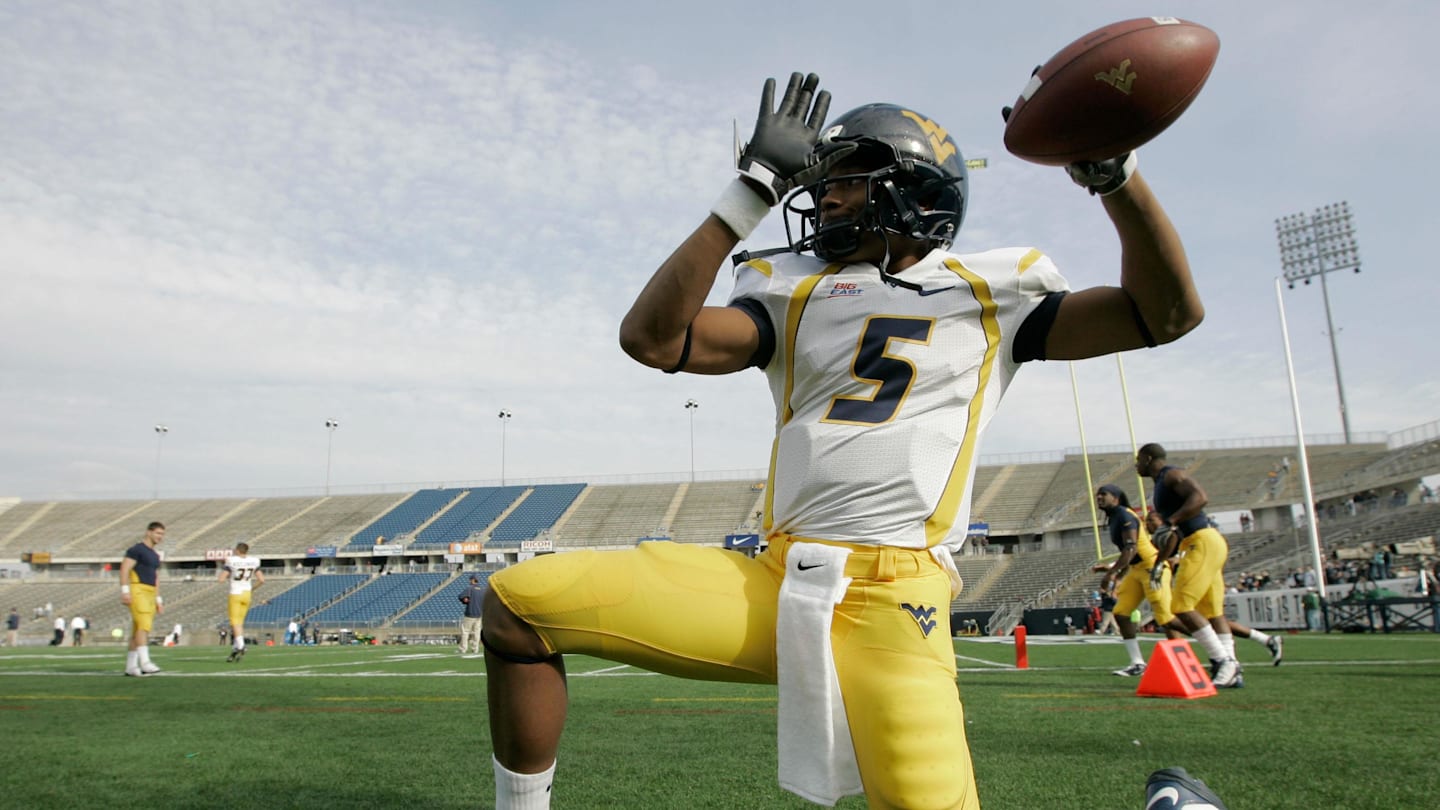 Nov 1, 2008; East Hartford, CT, USA; West Virginia Mountaineers quarterback Pat White (5) warms up before the start of the game against the Connecticut Huskies at Rentschler Field. Mandatory Credit: David Butler II-Imagn Images