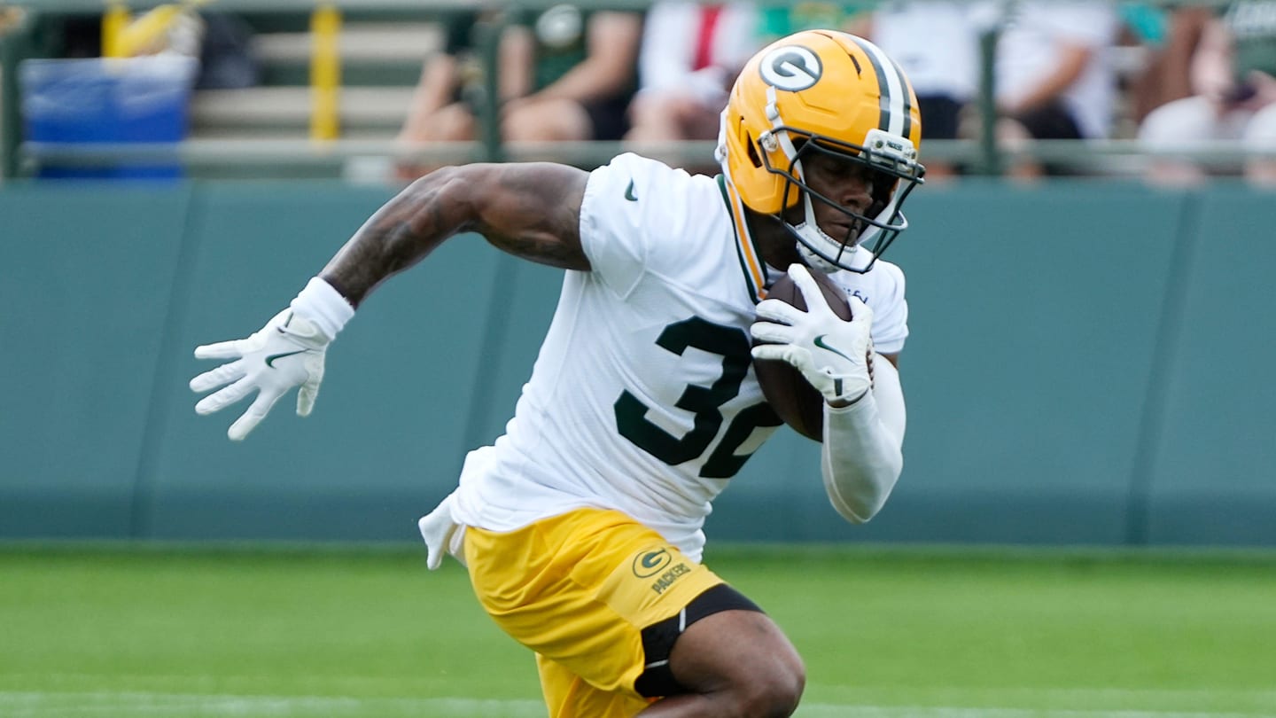 Green Bay Packers running back MarShawn Lloyd (32) runs through a drill during the second day of training camp on Thursday, July 24, 2025, at Ray Nitschke Field in Ashwaubenon, Wis.