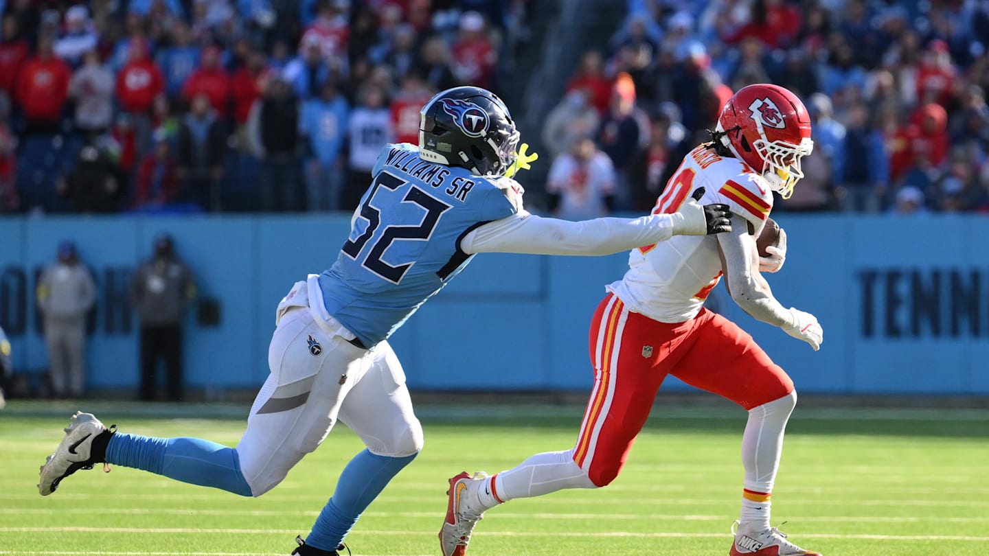 Dec 21, 2025; Nashville, Tennessee, USA; Kansas City Chiefs running back Isiah Pacheco (10) runs against Tennessee Titans linebacker James Williams Sr. (52) during the first half at Nissan Stadium. Mandatory Credit: Steve Roberts-Imagn Images