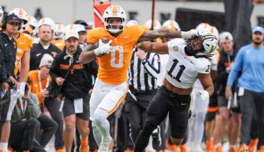 Tennessee tight end Ethan Davis (0) grabs the mask of Vanderbilt linebacker Bryan Longwell (11) during a NCAA football game between Tennessee and Vanderbilt at Neyland Stadium in Knoxville, Tenn., on Nov. 29, 2025.