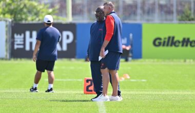 Jul 28, 2025; Foxborough, MA, USA; New England Patriots head coach Mike Vrabel (red sleeves) and defensive coordinator Terrell Williams watch players during training camp at Gillette Stadium. Mandatory Credit: Eric Canha-Imagn Images