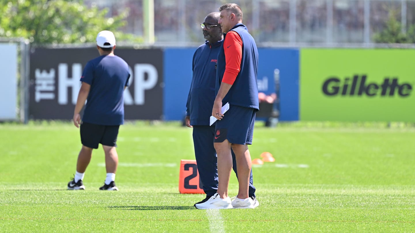 Jul 28, 2025; Foxborough, MA, USA; New England Patriots head coach Mike Vrabel (red sleeves) and defensive coordinator Terrell Williams watch players during training camp at Gillette Stadium. Mandatory Credit: Eric Canha-Imagn Images