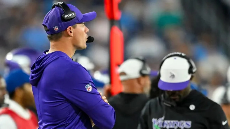 Vikings HC Kevin O'Connell in the foreground and defensive coordinator Brian Flores in the background.
