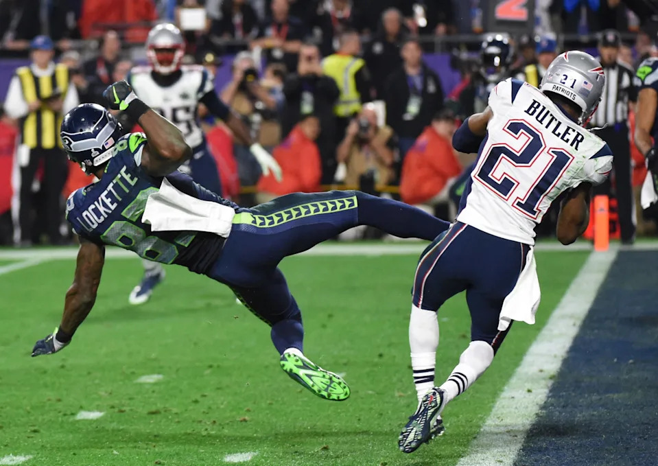 Malcolm Butler (R) of the New England Patriots intercepts a pass intended for Ricardo Lockette (L) of the Seattle Seahawks late in the fourth quarter of Super Bowl XLIX on February 1, 2015 at University of Phoenix Stadium in Glendale, Arizona. The New England Patriots defeated the Seattle Seahawks 28-24. AFP PHOTO / TIMOTHY A. CLARY (Photo by TIMOTHY A. CLARY / AFP) (Photo by TIMOTHY A. CLARY/AFP via Getty Images)