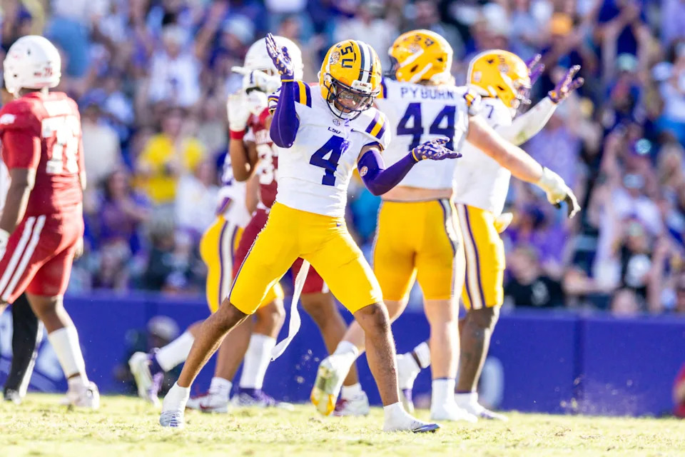 Nov 15, 2025; Baton Rouge, Louisiana, USA; LSU Tigers cornerback Mansoor Delane (4) reacts to a stop on fourth down against the Arkansas Razorbacks during the second half at Tiger Stadium.© Stephen Lew-Imagn Images