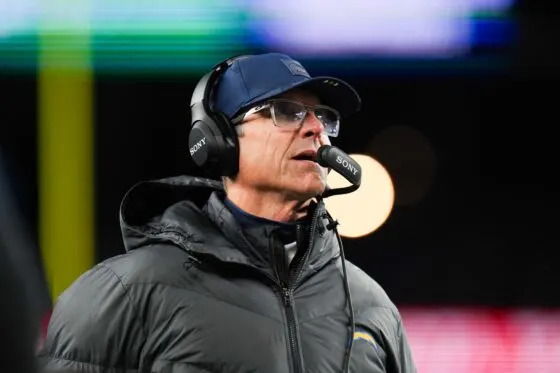 Los Angeles Chargers head coach Jim Harbaugh looks on during the first quarter against the New England Patriots in an AFC Wild Card Round game at Gillette Stadium on Jan 11, 2026.