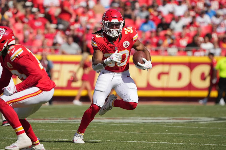 Aug 17, 2024; Kansas City, Missouri, USA; Kansas City Chiefs running back Keaontay Ingram (30) runs the ball against the Detroit Lions during the first half at GEHA Field at Arrowhead Stadium. Mandatory Credit: Denny Medley-USA TODAY Sports