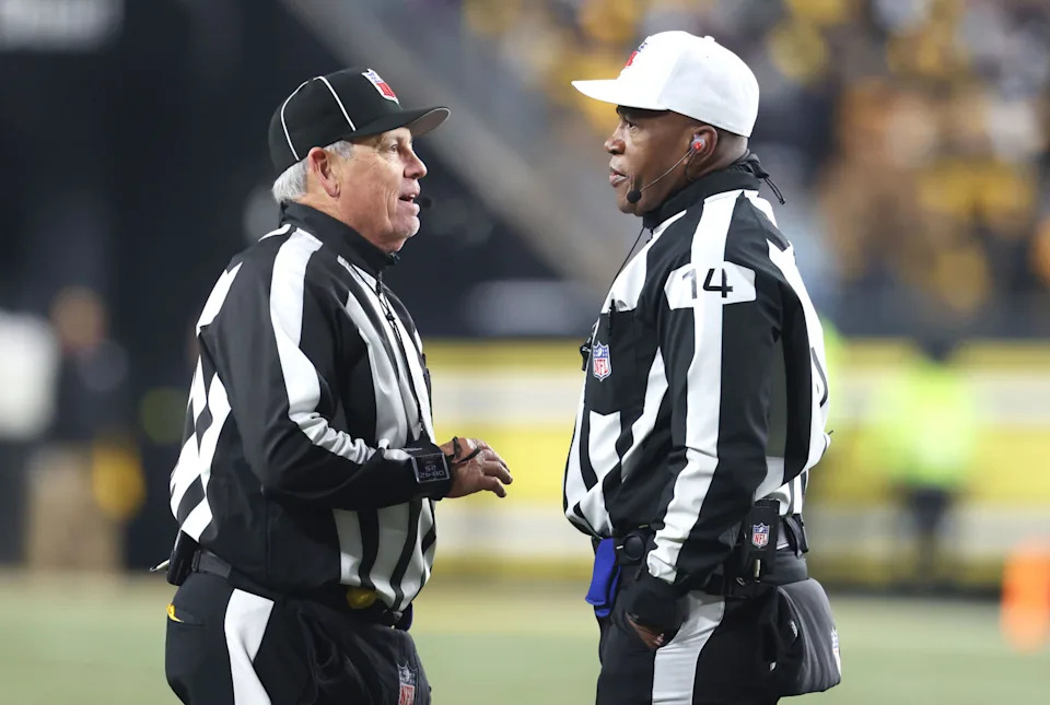 <p>NFL line judge Jeff Seeman (left) and referee Shawn Smith (14) discuss a call during the fourth quarter between the Baltimore Ravens and the Pittsburgh Steelers at Acrisure Stadium. Mandatory Credit: Charles LeClaire-Imagn Images</p>