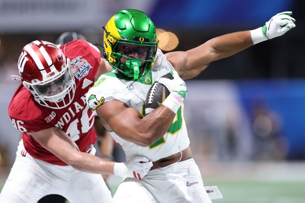 ATLANTA, GEORGIA - JANUARY 09: Kenyon Sadiq #18 of the Oregon Ducks is tackled by Isaiah Jones #46 of the Indiana Hoosiers during the first quarter in the 2025 College Football Playoff Semifinal at the Chick-fil-A Peach Bowl at Mercedes-Benz Stadium on January 09, 2026 in Atlanta, Georgia. (Photo by Kevin C. Cox/Getty Images)