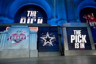 The onstage video screens display "The Pick Is In" for the Dallas Cowboys during the 2023...