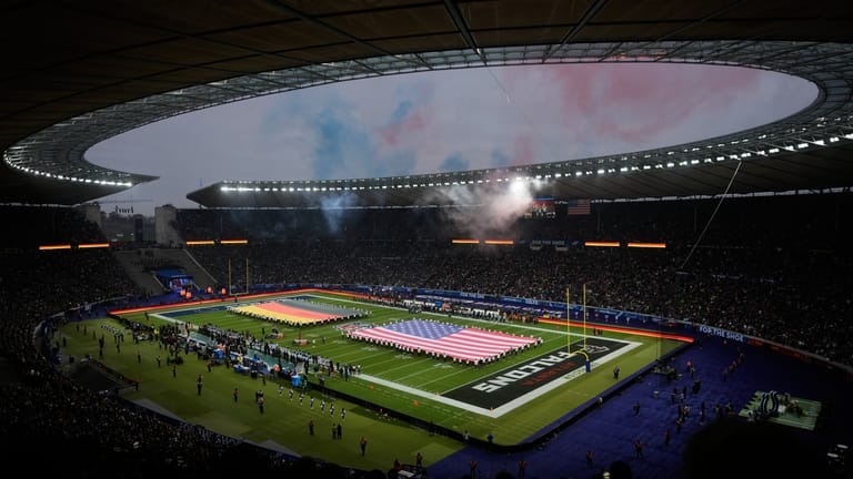 Fans cheer during the opening ceremony prior to the NFL...