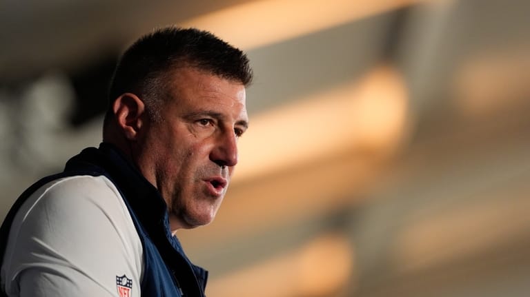 New England Patriots head coach Mike Vrabel talks to the...