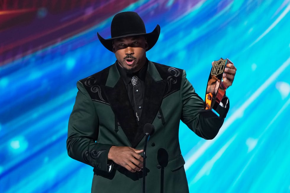 Cleveland Browns' Myles Garrett excepts the AP Defensive Player of the Year award during the...