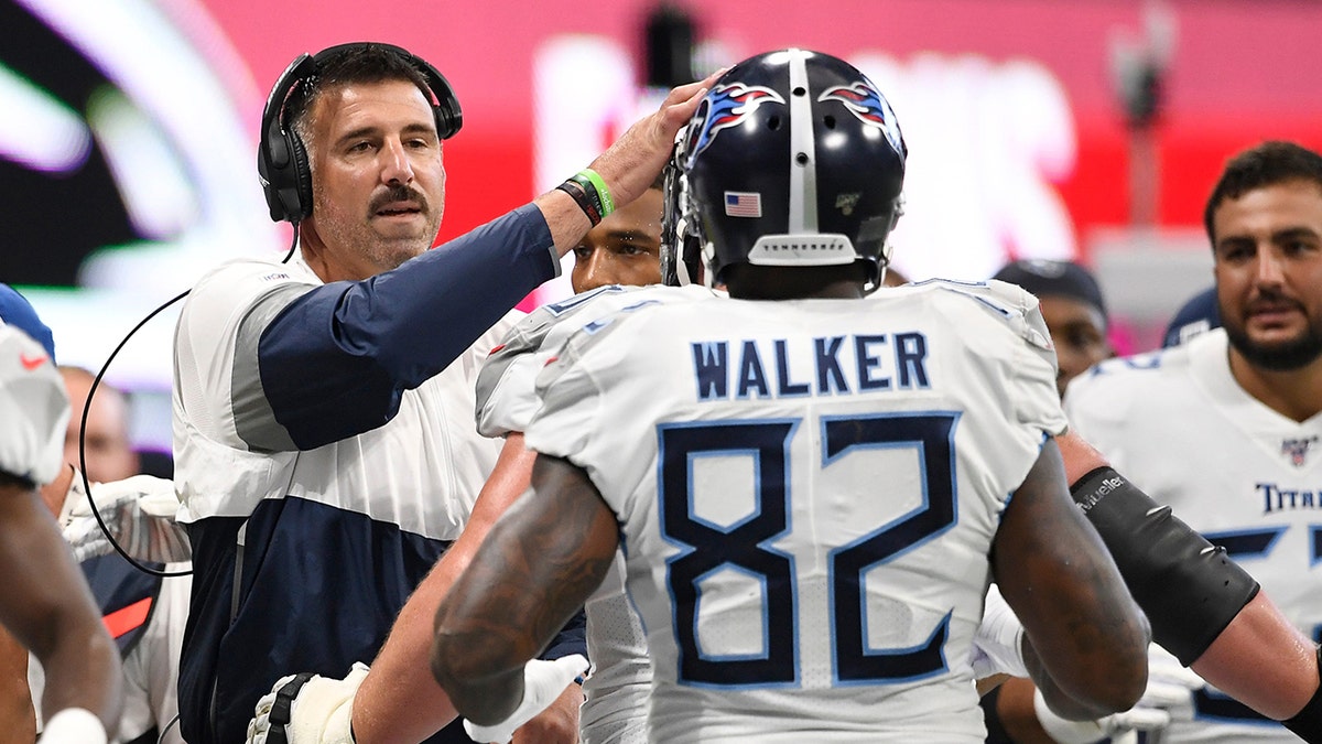 Mike Vrabel greeting Delanie Walker