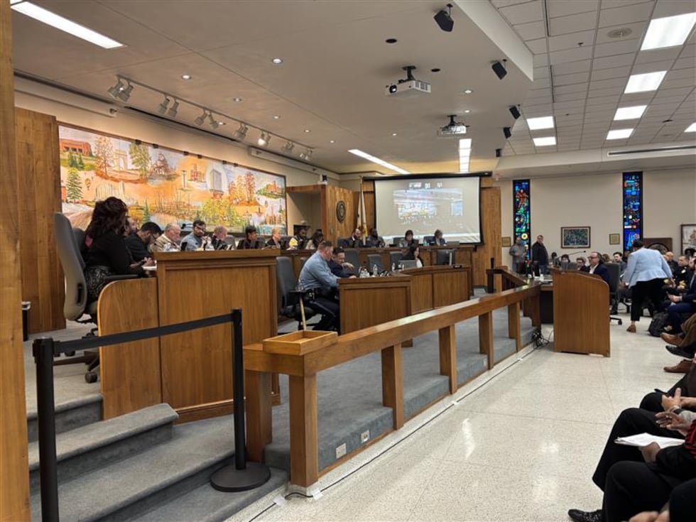 Community members pack a Wyandotte County Commission meeting to hear the Commissioners' votes...