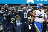 Seattle Seahawks linebacker DeMarcus Lawrence (0) celebrates after sacking Los Angeles Rams...