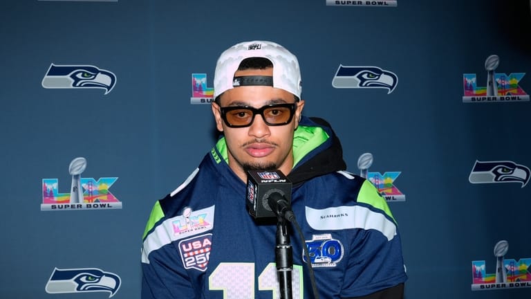 Seattle Seahawks wide receiver Jaxon Smith-Njigba speaks during a news...