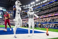 Dallas Cowboys wide receiver Ceedee Lamb (88) celebrates with teammate George Pickens (3)...