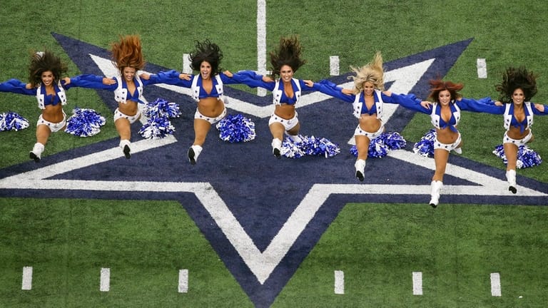 The Dallas Cowboys Cheerleaders perform before a game against the...