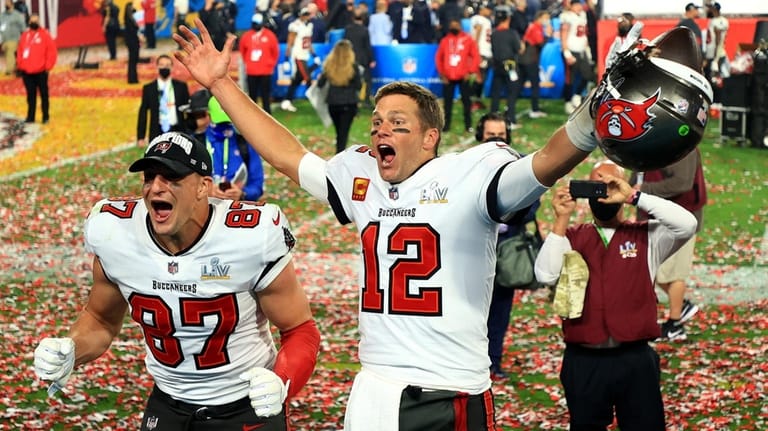 Rob Gronkowski and Tom Brady celebrate after Tampa Bay beat...