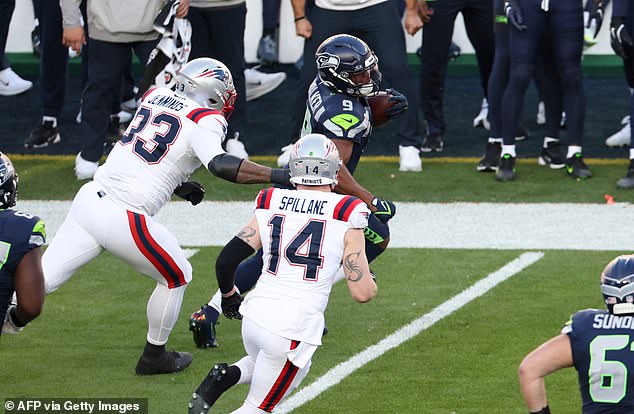 Seattle Seahawks' running back #09 Kenneth Walker III runs with the ball during Super Bowl LX between the New England Patriots and the Seattle Seahawks at Levi's Stadium in Santa Clara, California on February 8, 2026. (Photo by Patrick T. Fallon / AFP via Getty Images)