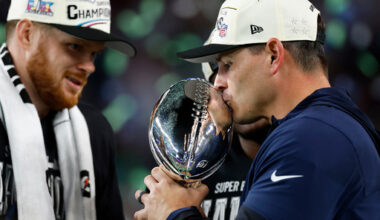 Seattle Seahawks head coach Mike Macdonald kisses the Lombardi Trophy as quarterback Sam Darnold (14) looks on after the Seahawks defeated the New England Patriots in the Super Bowl 60 in Santa Clara, Calif., Sunday, Feb. 8, 2026. (Scott Strazzante/San Francisco Chronicle via AP)