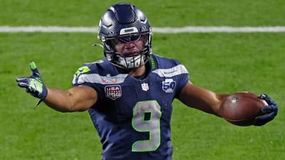 Seahawks running back Kenneth Walker III rushes during Super Bowl...