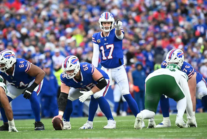 Dec 29, 2024; Orchard Park, New York, USA; Buffalo Bills quarterback Josh Allen (17) and guard Connor McGovern (66) at the line of scrimmage in the third quarter against the New York Jets at Highmark Stadium. Mandatory Credit: Mark Konezny-Imagn Images