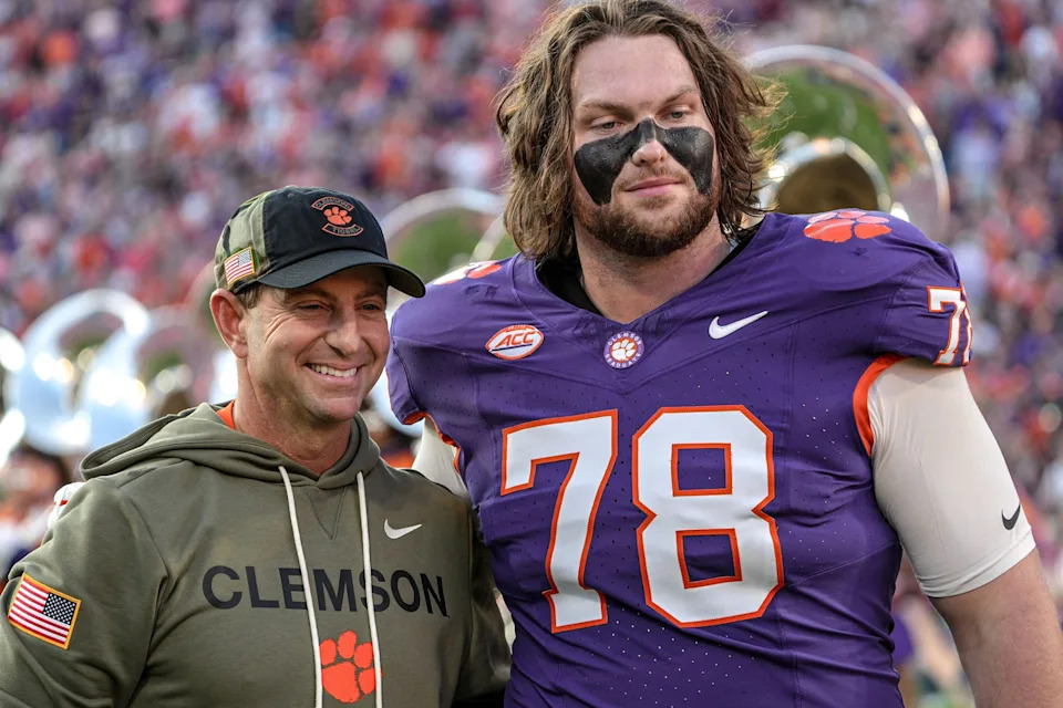 Clemson head coach Dabo Swinney with offensive lineman Blake Miller (78) before kickoff with Furman University at Memorial Stadium in Clemson, SC, Saturday, November 22, 2025.