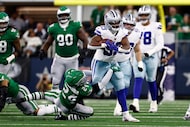 Philadelphia Eagles safety Andrew Mukuba (24) tackles Dallas Cowboys running back Javonte...