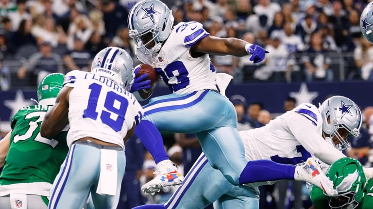 Dallas Cowboys running back Javonte Williams (33) carries the ball...