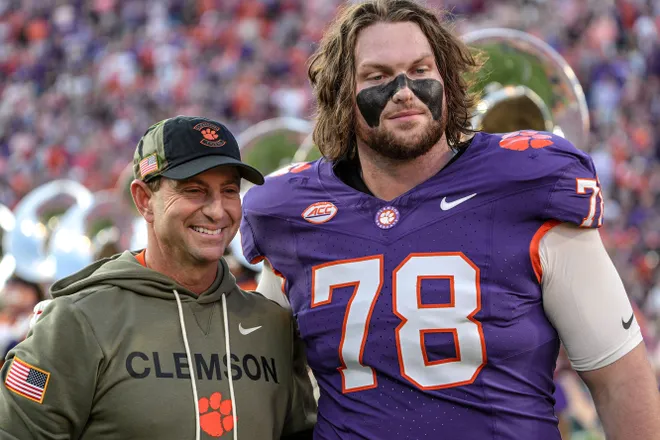 Clemson head coach Dabo Swinney with offensive lineman Blake Miller (78) before kickoff with Furman University at Memorial Stadium in Clemson, SC, Saturday, November 22, 2025.