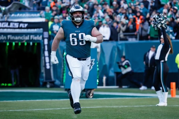 Philadelphia Eagles left guard Landon Dickerson runs onto the field before a 2025 game at Lincoln Financial Field. (AP file photo)
