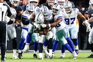 Dallas Cowboys defensive tackle Kenny Clark (95) stops Las Vegas Raiders running back Ashton...
