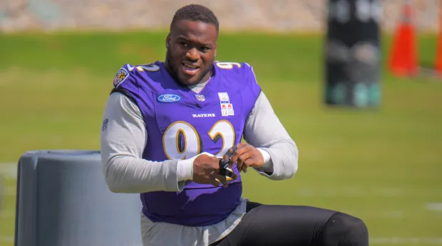 Baltimore Ravens defensive lineman Nnamdi Madubuike secures his fingers during team practice for the upcoming NFL season opener against the Buffalo Bills. (Karl Merton Ferron/Staff)
