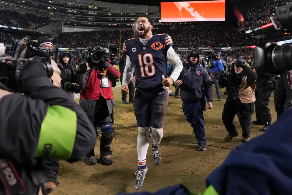 Caleb Williams #18 of the Chicago Bears celebrates after an NFL Wild Card game against the Green Bay Packers at Solider Field on January 10, 2026 in Chicago, Illinois