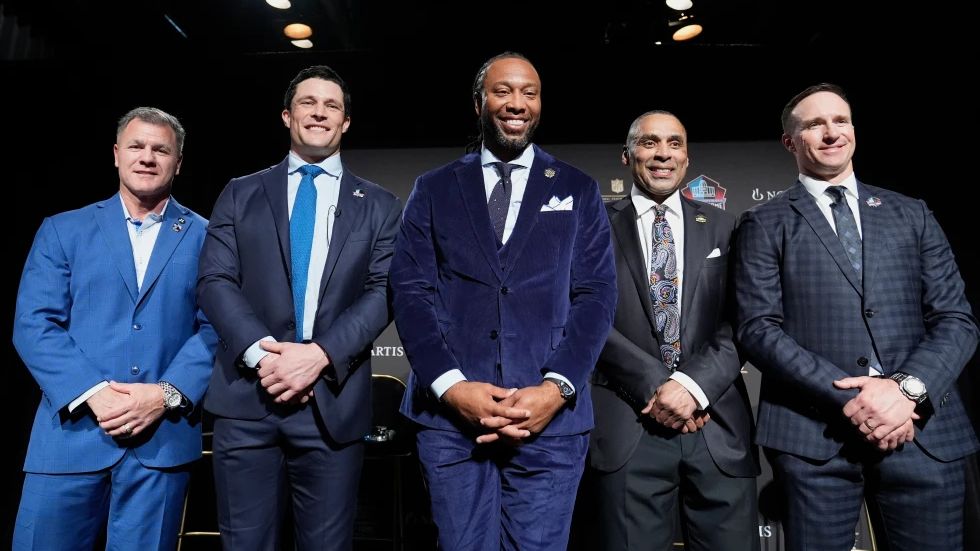 Adam Vinatieri, from left, stands with Luke Kuechly, Larry Fitzgerald, Roger Craig and Drew Brees after being announced for the Pro Football Hall of Fame class of 2026 during football's NFL Honors award show in San Francisco, Thursday, Feb. 5, 2026. (AP Photo/Brynn Anderson)