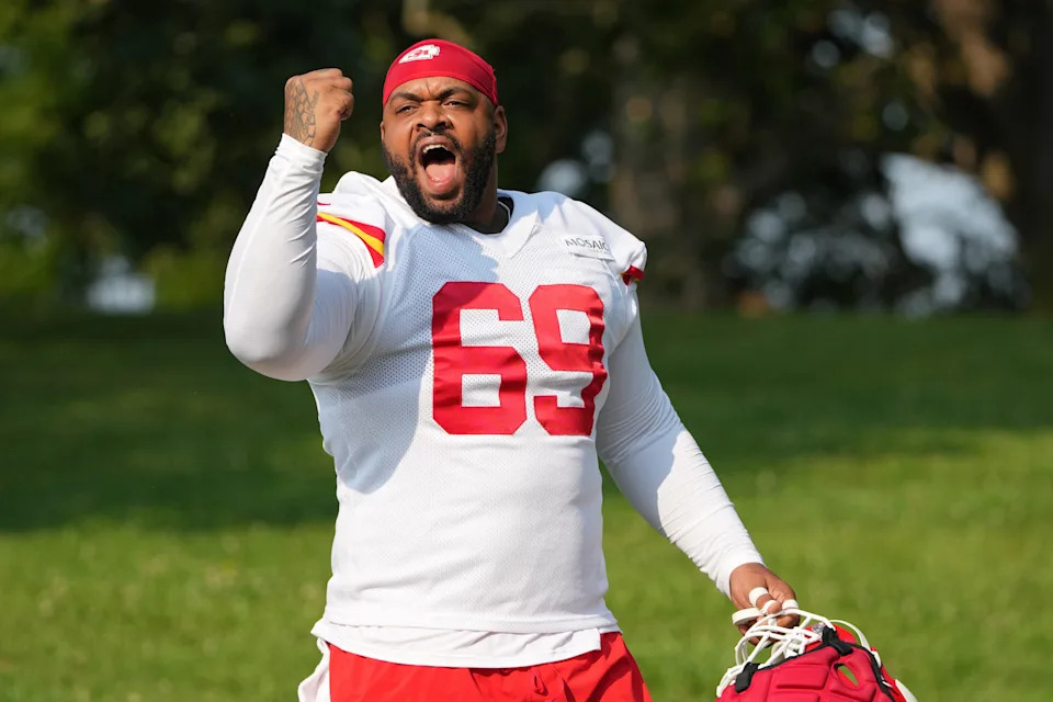 Jul 22, 2024; St. Joseph, MO, USA; Kansas City Chiefs defensive tackle Mike Pennel Jr. (69) gestures to fans while walking from the locker room to the fields prior to training camp at Missouri Western State University. Mandatory Credit: Denny Medley-USA TODAY Sports