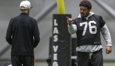 Raiders guard Caleb Rogers (76) points towards senior offensive assistant Joe Philbin during th ...