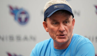 Tennessee Titans interim head coach Mike McCoy talks to reporters after an NFL football game ag ...