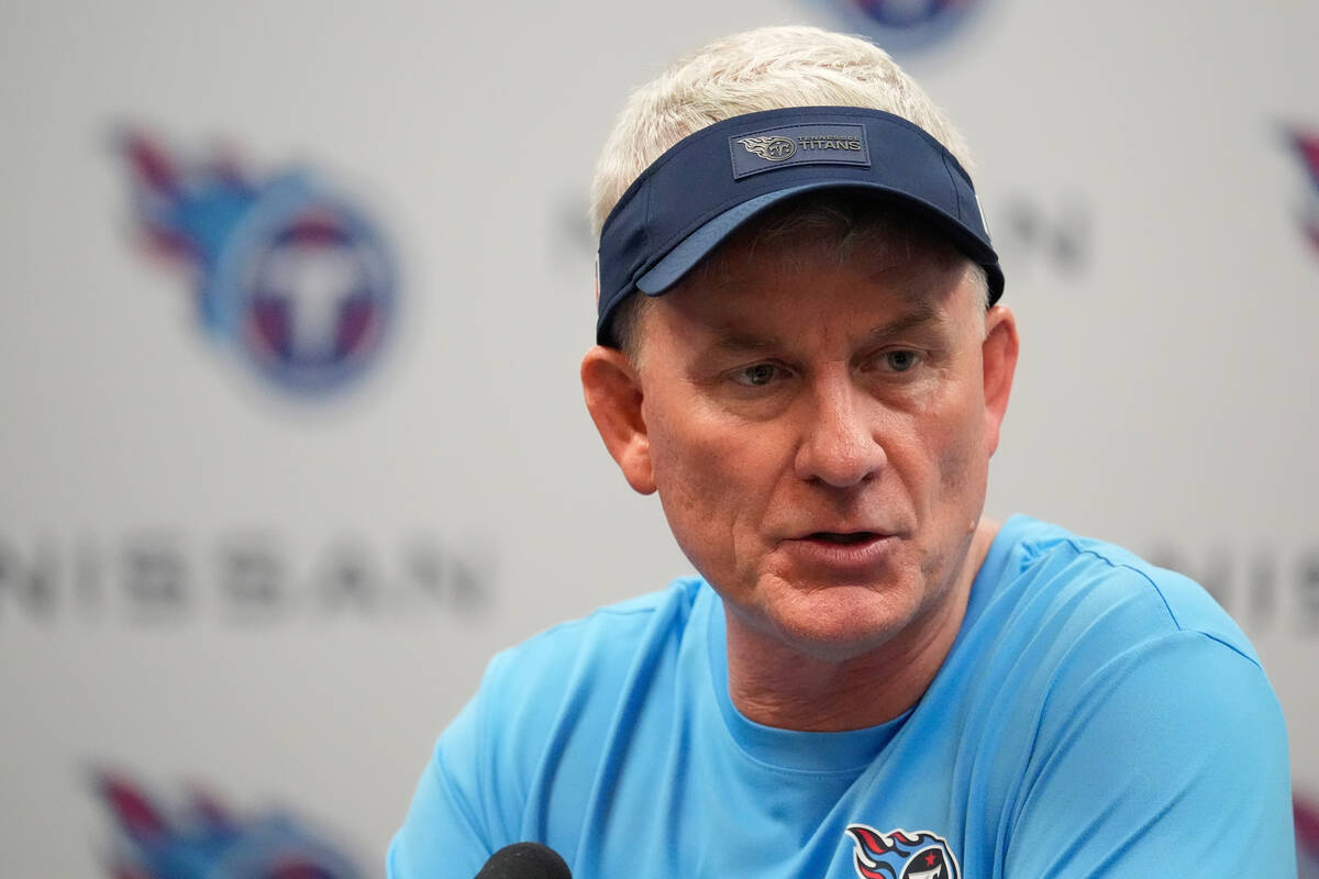 Tennessee Titans interim head coach Mike McCoy talks to reporters after an NFL football game ag ...